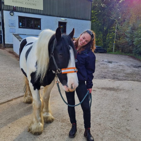 Pony and rider in the stables yard