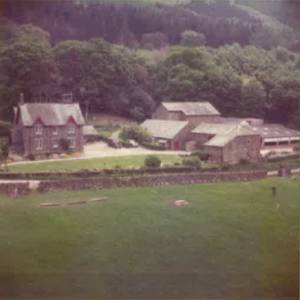 Old image of Calvert Lakes with trees behind and pasture in front