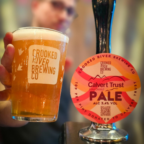 Calvert Pale cask ale tap with a full pint glass of Calvert Pale beside it