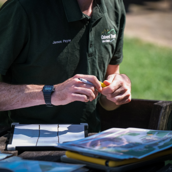 instructor with a map and pen