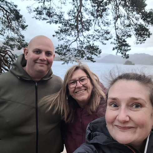 Selfie of three adults at Friars Crag in Keswick