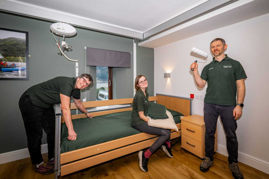 Three housekeepers in a newly refurbished room