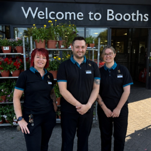 Staff from Booths Keswick standing outside the front of the shop