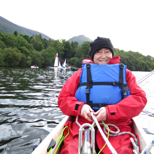 Woman sitting in a sailing boat on Bassenthwaite Lake