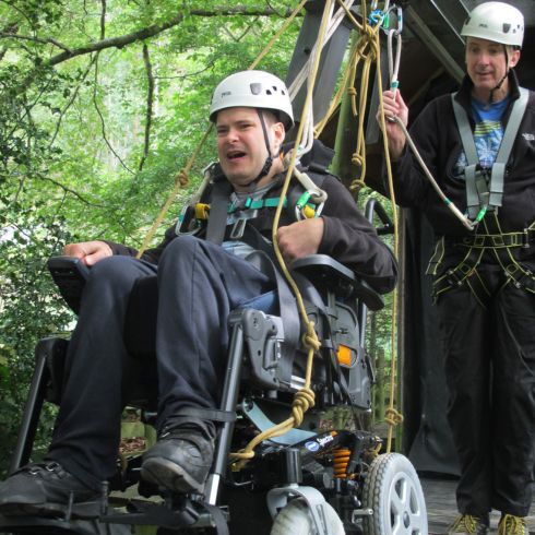 Wheelchair user in power chair on wheelchair challenge course