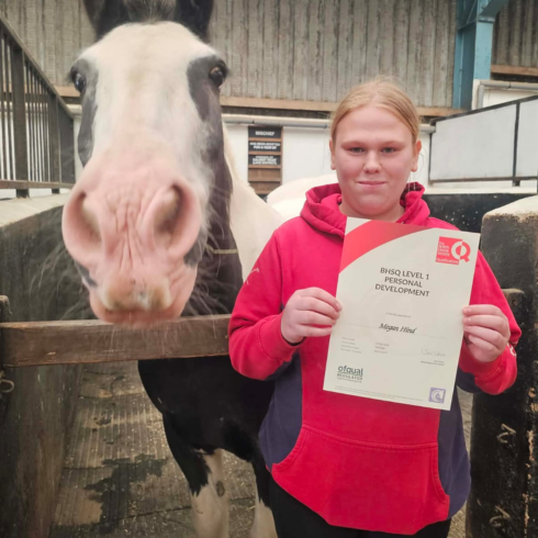 Alternative education learned with her certificate and a pony beside her at the stables