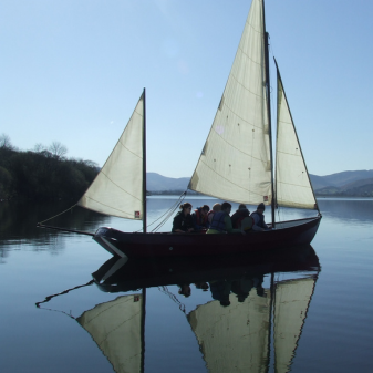 Sailing boat anchored on calm waters on Bassenthwaite Lake